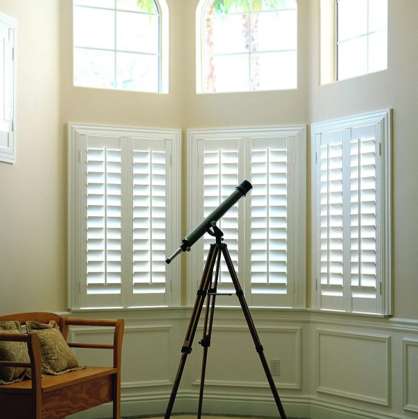 Woodlore Shutters, outside mount, 3" ridge Deco frame, 4-1/2" louvers, silk white finish.